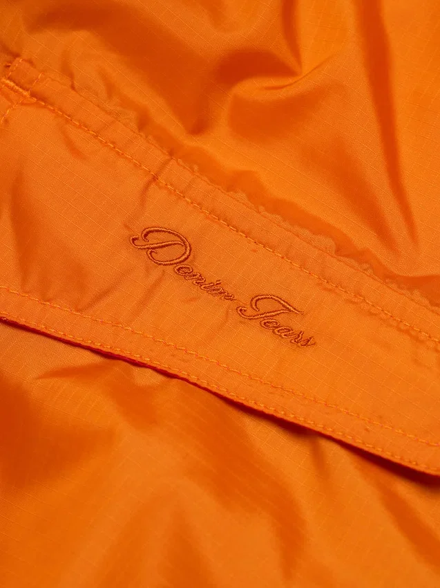 Cortavientos Script naranja