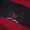 Pantalón de chándal a rayas con escudo y bajo abierto, rojo/azul marino