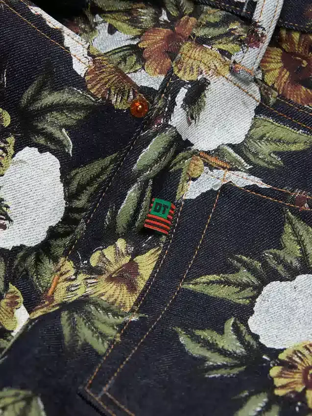 Pantalones holgados de Denim con estampado floral y ribete