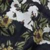 Pantalones holgados de Denim con estampado floral y ribete