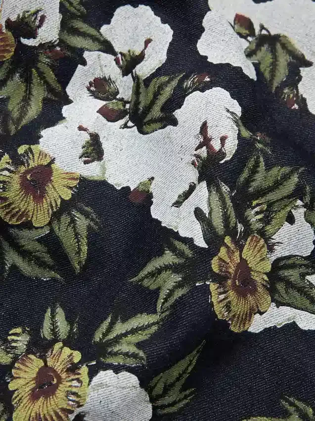 Pantalones holgados de Denim con estampado floral y ribete